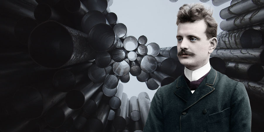 The composer Jean Sibelius as a young man wearing a suit, bow tie, moustache and slightly tousled hair. In the background of the collage is a view of the Sibelius Monument in Helsinki with dozens of metallic tubes, through which the light blue sky is visi