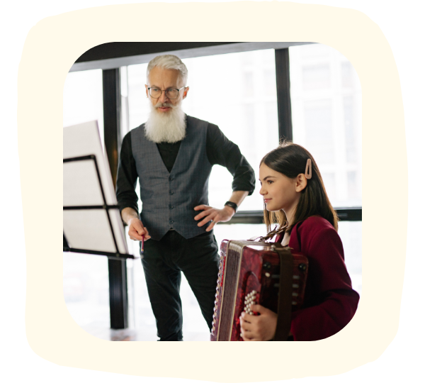 Mädchen mit Akkordeon und Lehrer