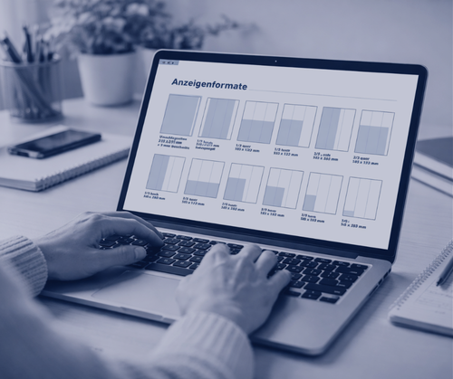 person at a desck visiting a webpage with advert formats